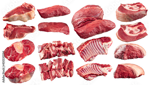 Collage of different isolated raw beef meat parts on the white background