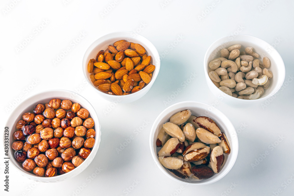 Process of soaking various nuts: almonds, hazelnuts, cashew, brazilian nut in water to activate. Home Cooking: making plant based organic veggie Milk, lactose free Process of soaking various nuts: almonds, hazelnuts, cashew, brazilian nut in water to activate. Home Cooking: making plant based organic veggie Milk, lactose free