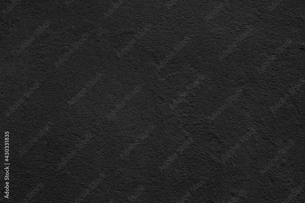 Fototapeta premium Texture of rough black plaster. Architectural abstract background.