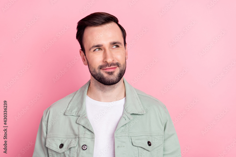 Fototapeta premium Photo of nice optimistic brunet man look empty space wear grey shirt isolated on pastel pink color background