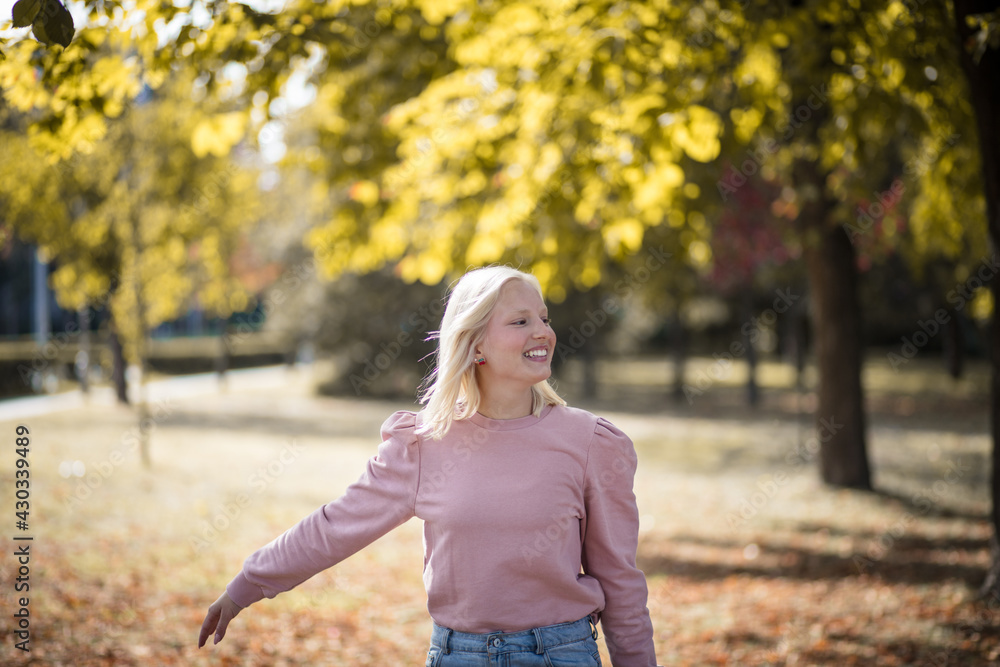 Happy young woman enjoying in the park. Happy young woman enjoying in the park.