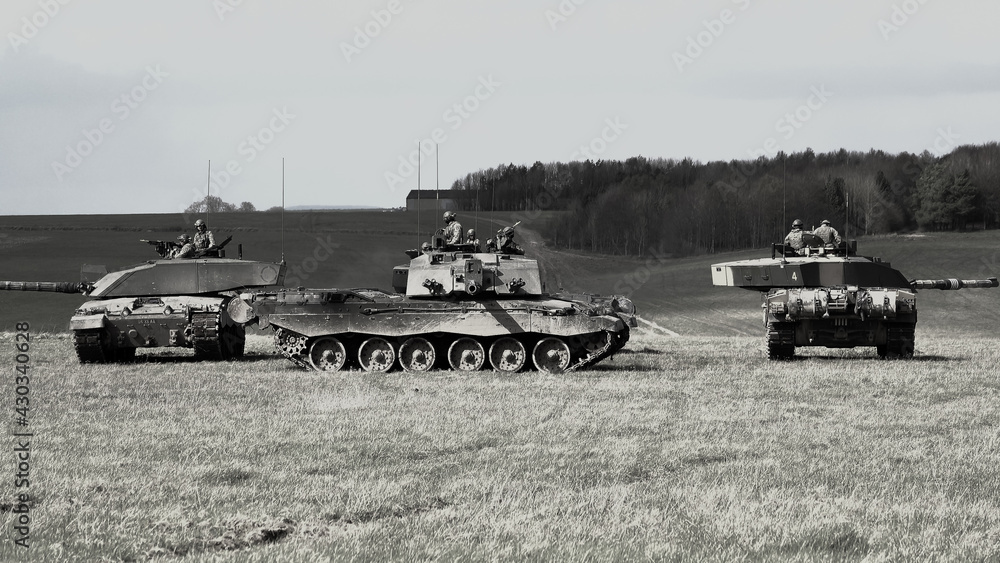Fototapeta premium Four British Army Challenger 2 main battle tanks in a defensive square on a military exercise Wiltshire UK