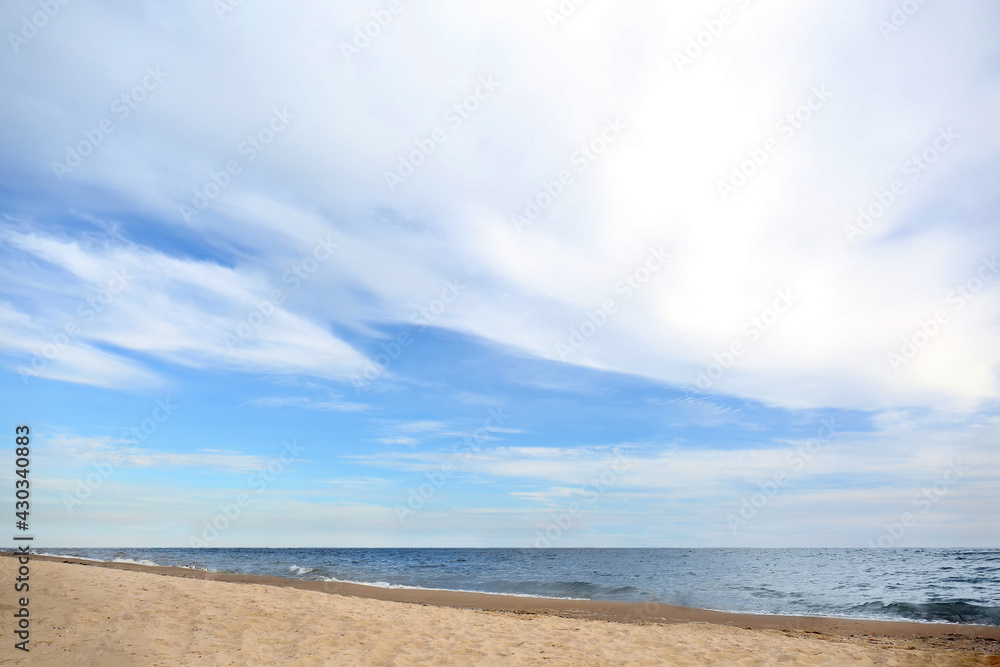 Beautiful sea coast with seagulls under blue sky Beautiful sea coast with seagulls under blue sky