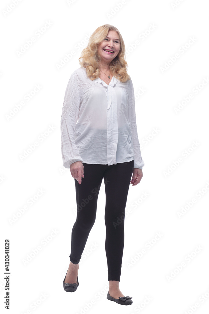 happy mature woman in a new blouse striding forward. happy mature woman in a new blouse striding forward.