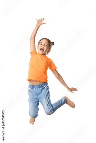 Cute little girl jumping on white background