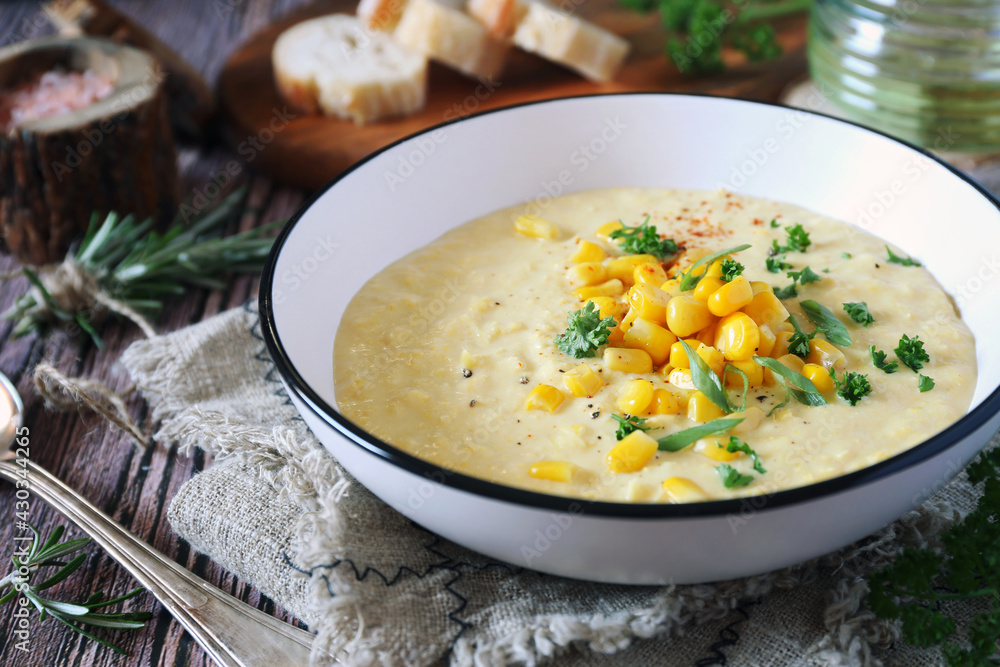 Corn Chowder. American cuisine. Creamy corn soup, green onions and parsley dressing Corn Chowder. American cuisine. Creamy corn soup, green onions and parsley dressing