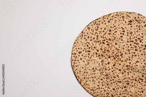 Tasty matzo isolated on white, top view. Passover (Pesach) celebration