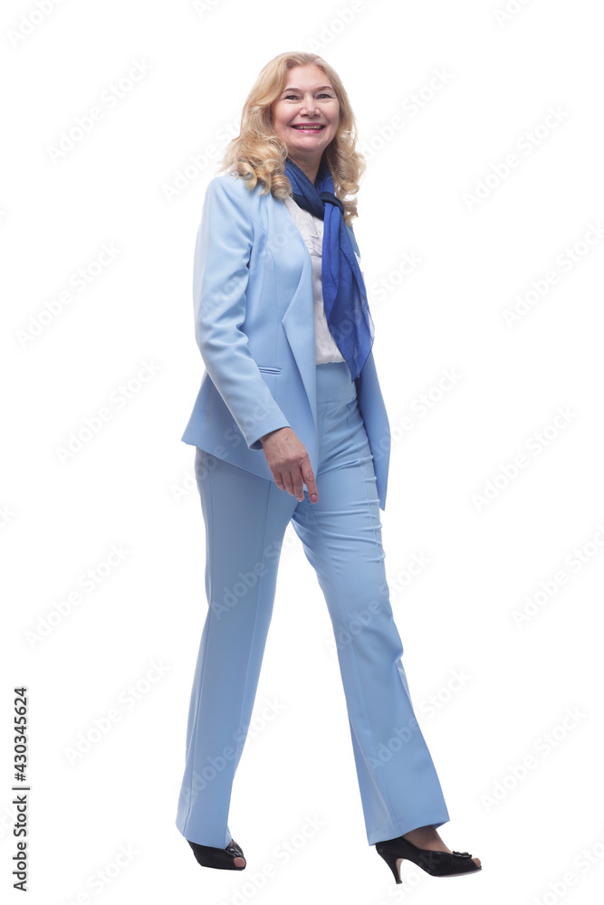 in full growth. happy woman in a pantsuit striding forward. in full growth. happy woman in a pantsuit striding forward.