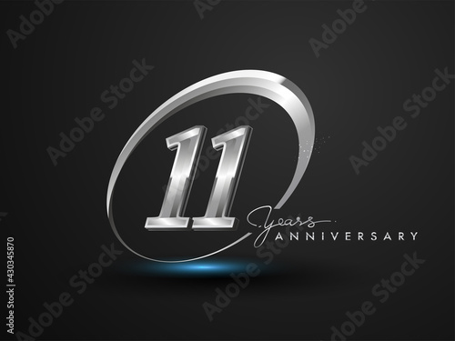 11 Years Anniversary Celebration. Anniversary logo with ring and elegance silver color isolated on black background, vector design for celebration, invitation card, and greeting card