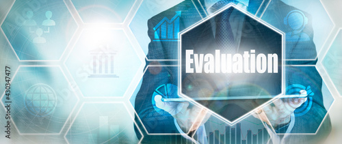 A Evaluation business word concept on a futuristic blue display.