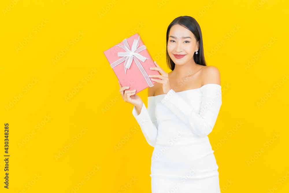 Portrait beautiful young business asian woman with red gift box Portrait beautiful young business asian woman with red gift box