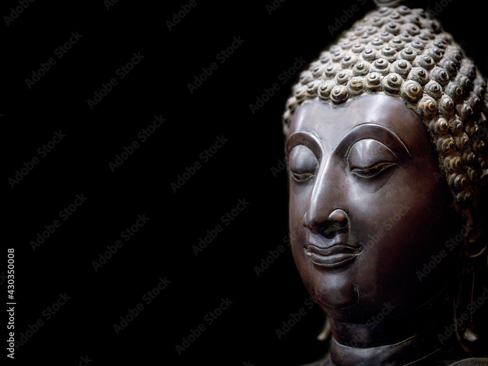 Buddha face statue. A heritage antique symbol of clam, enlighten and meditate. Head and face statue of Buddhism religion, show traditional culture of Asian spirituality. Portrait sculpture style.
