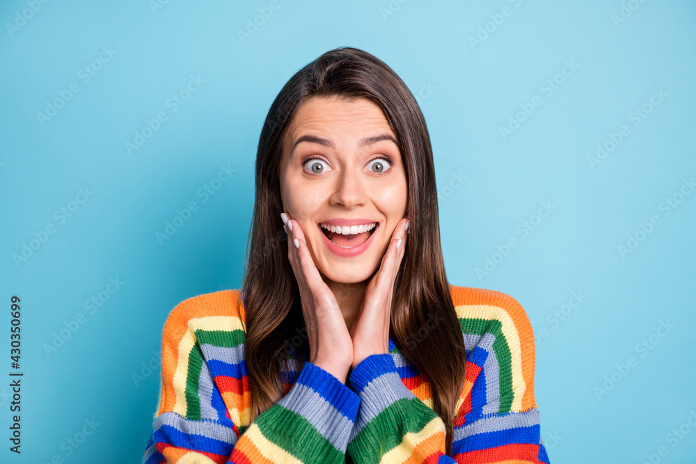 Fototapeta premium Photo portrait of shocked woman touching cheeks opened mouth staring isolated on bright blue color background