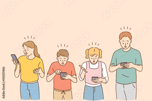 Technologies and shock concept. Shocked schoolkids children cartoon characters looking into their mobile phones feeling surprised vector illustration 