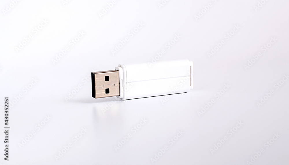 USB stick on a light background. Place for your text. USB stick on a light background. Place for your text.
