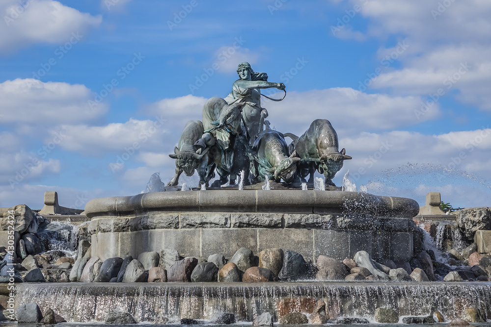 View of famous Gefion Fountain (Gefionspringvandet, 1899) in Copenhagen. Gefion Fountain depicting legendary Norse goddess driving four oxen. It designed by Danish artist Anders Bundgaard. Denmark.