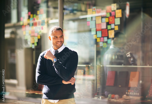 Outdoor portrait of handsome african american man, wearing blue pullover