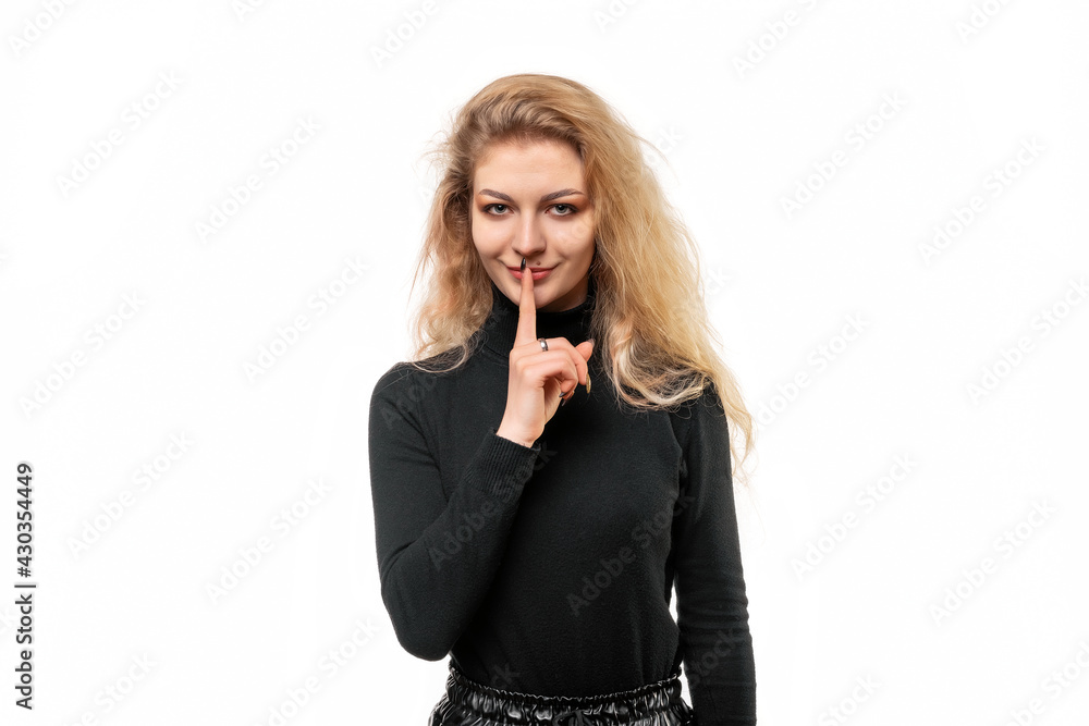 Portrait of blonde girl keeping finger at her mouth, saying Shh, Hush, Tsss. Silence and secret concept, isolated Portrait of blonde girl keeping finger at her mouth, saying Shh, Hush, Tsss. Silence and secret concept, isolated