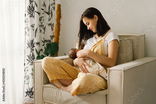 Obraz na płótnie Newborn baby boy sucking milk from mothers breast