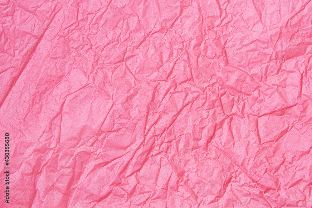 Fototapeta premium Hot pink crumpled paper texture background.