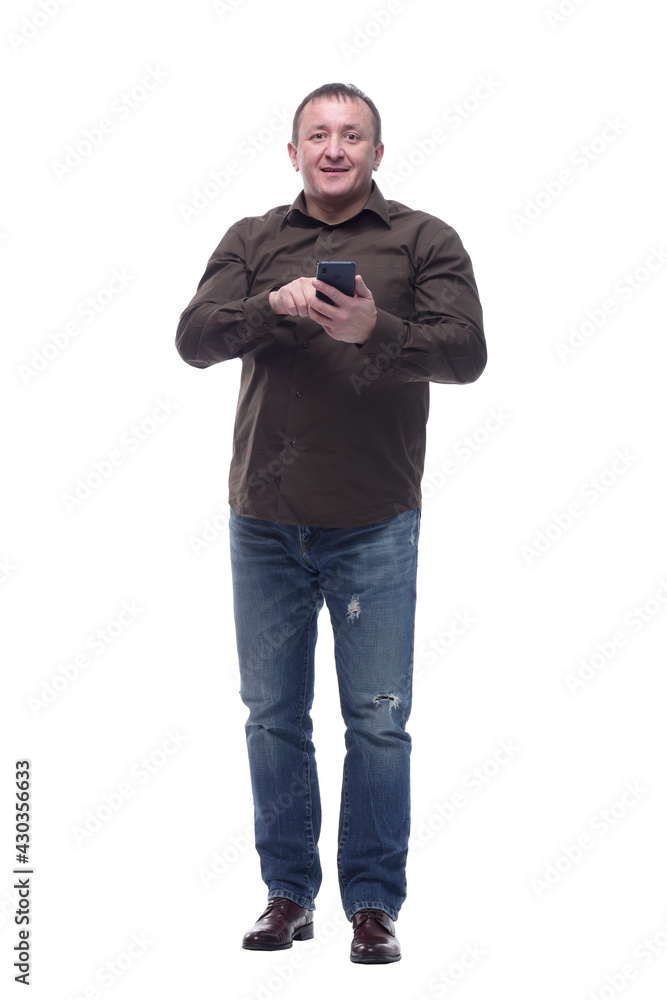 in full growth. smiling mature man with a smartphone. in full growth. smiling mature man with a smartphone.