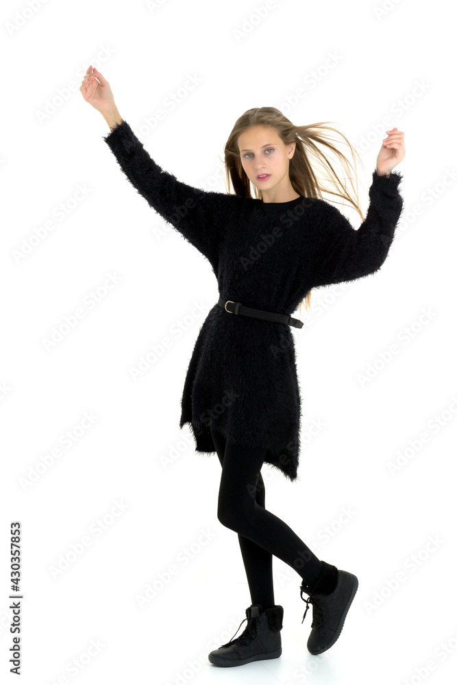 Pretty teenage long haired girl in black clothes