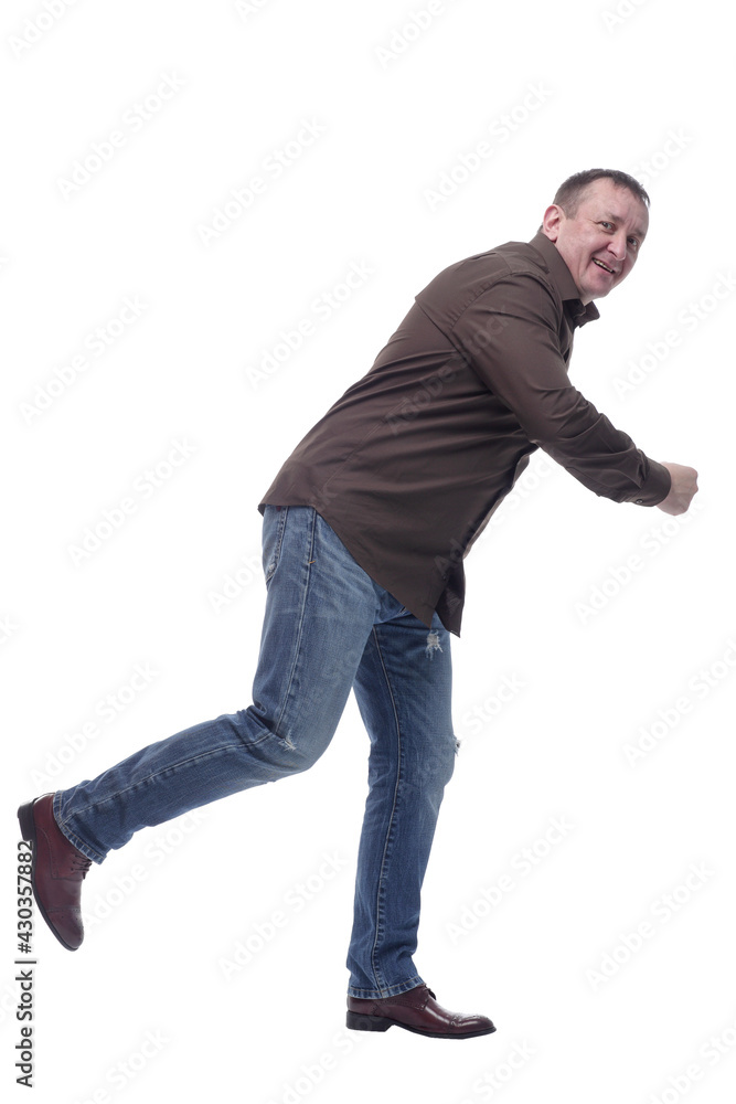 side view . smiling mature man somewhere in a hurry . side view . smiling mature man somewhere in a hurry .