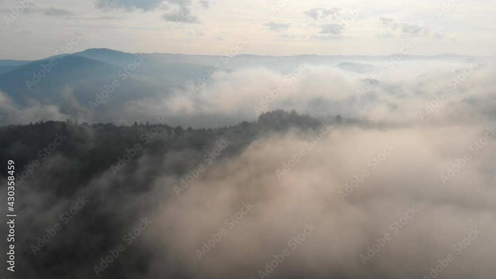 Clouds and fog over morning Carpathian mountains. Aerial shot Clouds and fog over morning Carpathian mountains. Aerial shot