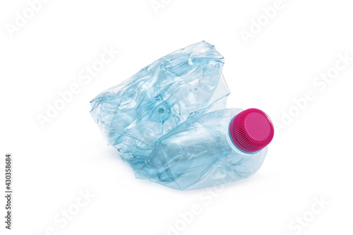 Slika na platnu Empty plastic water bottle scaled for recycling isolated on white background