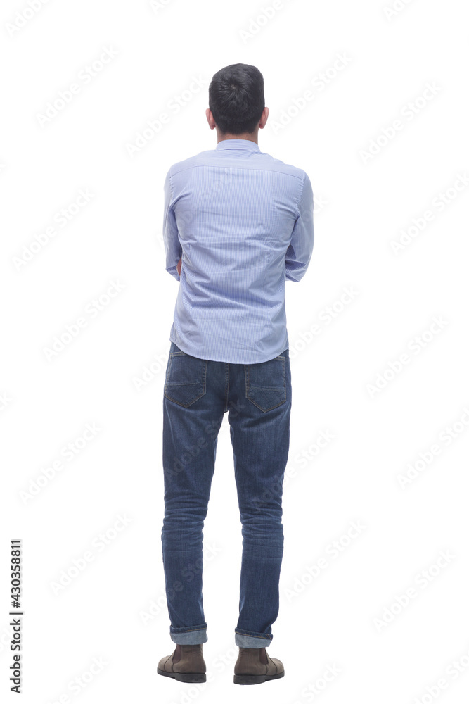 rear view . a young man in jeans looking at a white screen. rear view . a young man in jeans looking at a white screen.