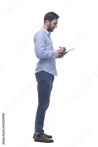 side view. young man pointing at blank in clipboard. © ASDF
