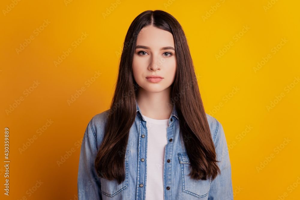Portrait of charming adorable young girl on yellow background Portrait of charming adorable young girl on yellow background