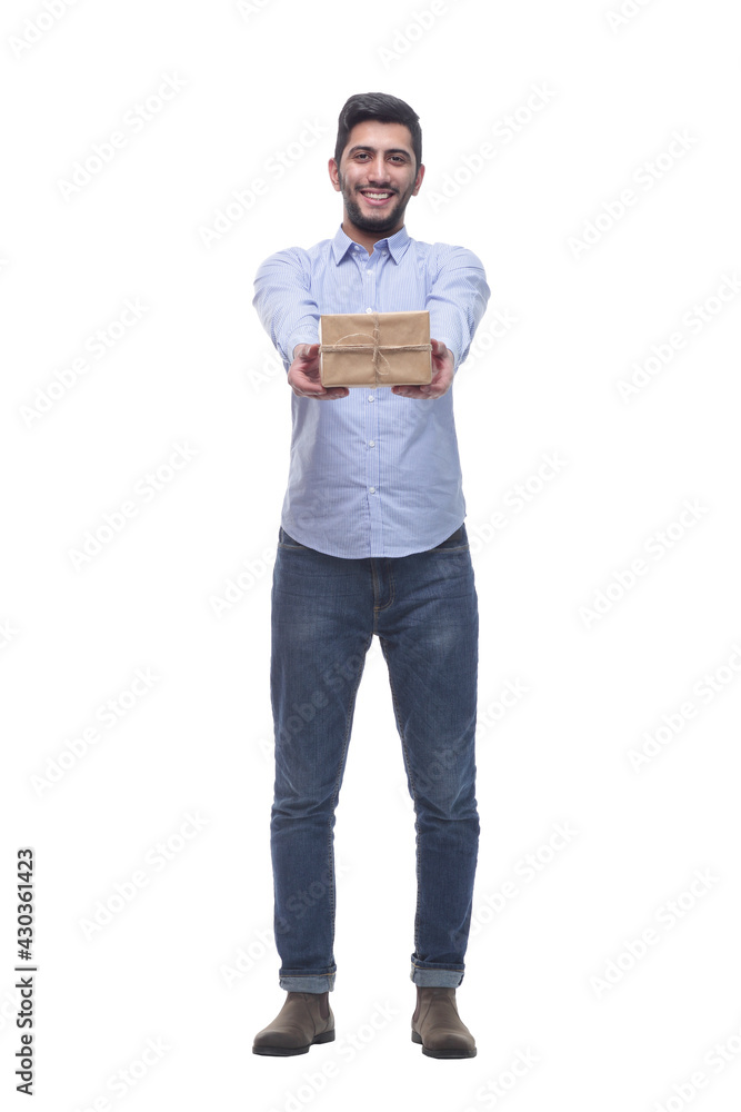 in full growth. happy young man with a gift. in full growth. happy young man with a gift.