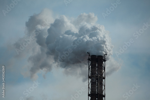 Production Pipe with White Smoke on the Background of A Cloudy Sky. Emissions to the Atmosphere. Concept Environmental Pollution, Gas Cleaning, Metallurgy, Manufacturing, Industry