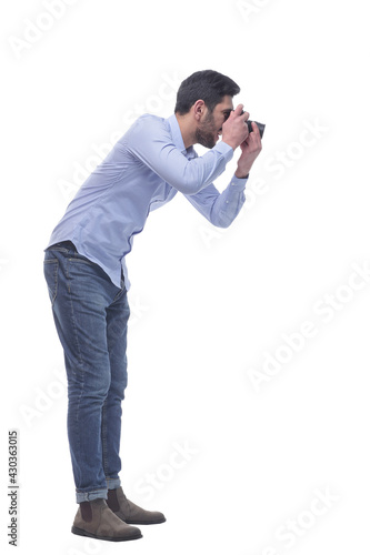 side view. male photographer with a camera.