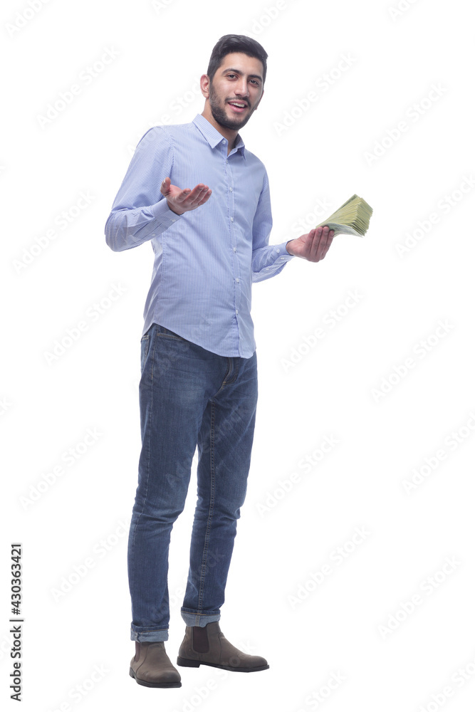 in full growth. confident young man with dollar bills . in full growth. confident young man with dollar bills .
