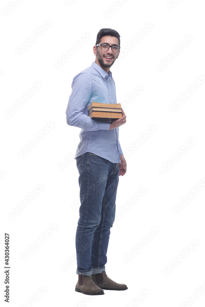 casual young man with a stack of books. casual young man with a stack of books.