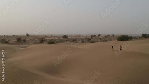 Thar Desert with People Walking photo
