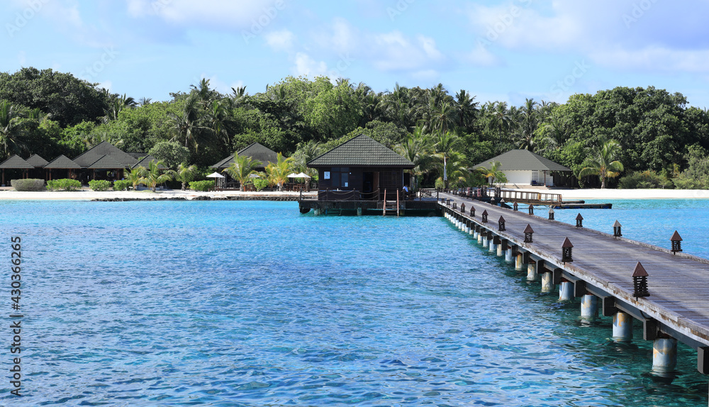 wooden pier on a tropical island, Maldives
