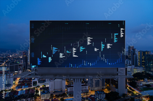 Photography FOREX graph hologram on billboard, aerial night panoramic cityscape of Kuala Lumpur
