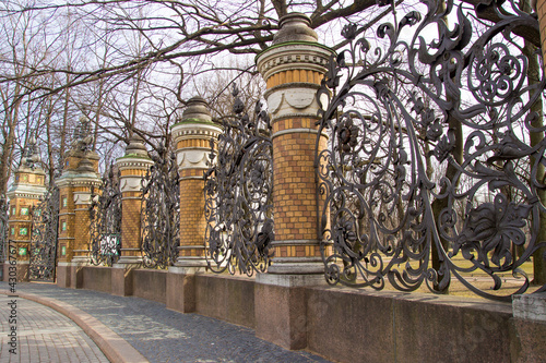 Old metal fences in the city park of St. Petersburg. photo