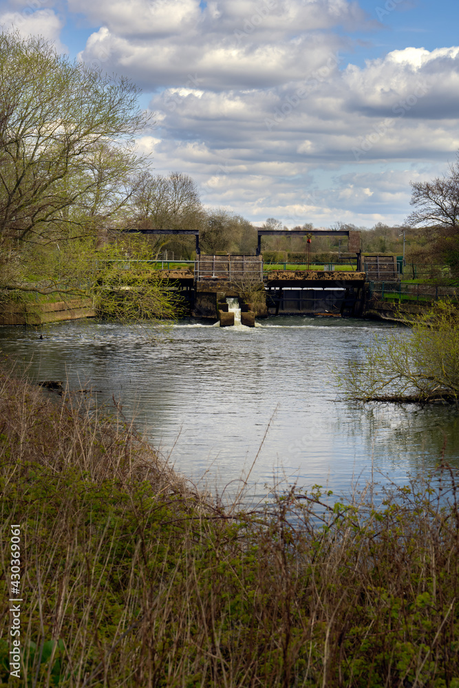Sluice gate on the Ouse, walking on the Ouse path on a spring afternoon, Sussex, England