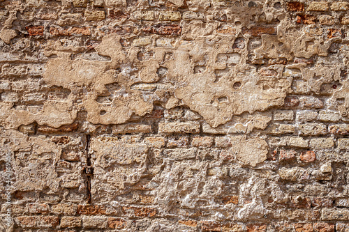 Old brick and plaster wall texture background