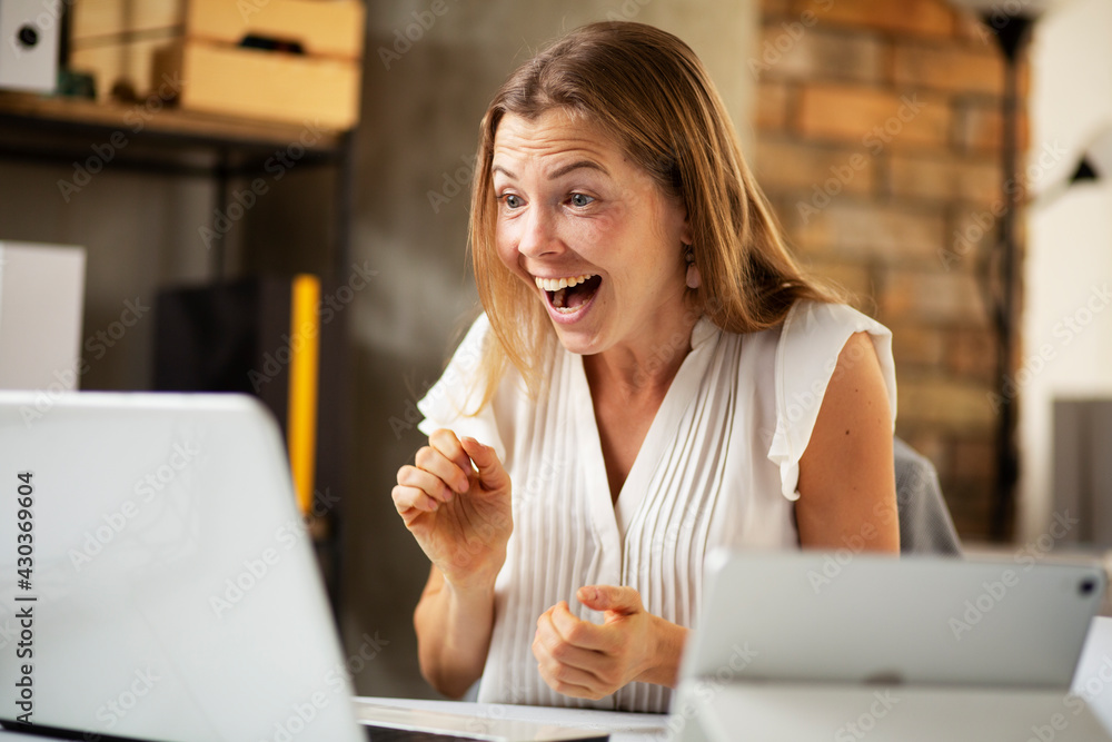 Businesswoman is having a video call on laptop..Happy businesswoman using laptop in the office. Businesswoman is having a video call on laptop..Happy businesswoman using laptop in the office.