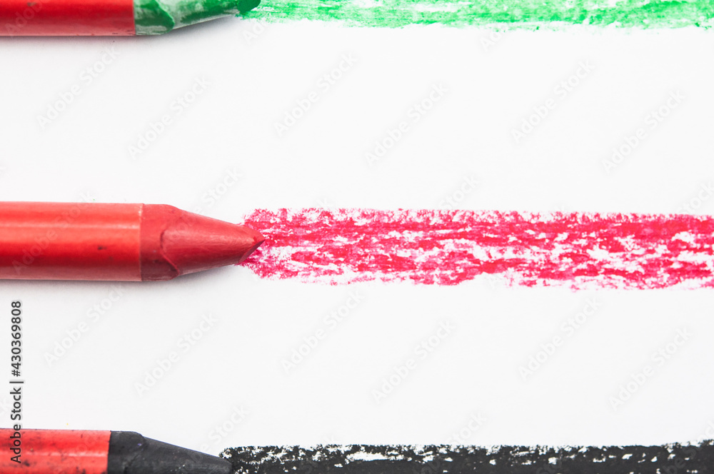Fototapeta premium Kid's drawn rainbow and colorful crayons on white background