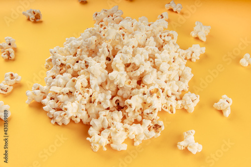 White popcorn on a yellow background