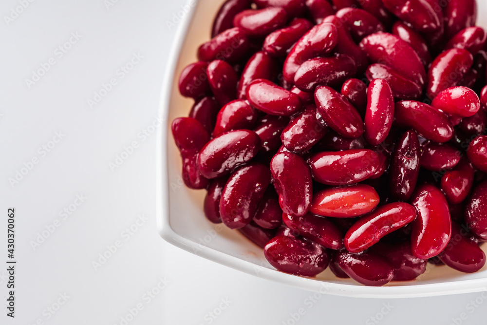 canned red kidney beans on a white acrylic background canned red kidney beans on a white acrylic background