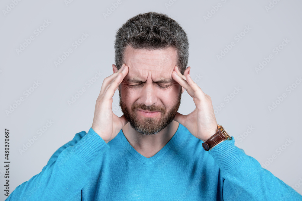 mature man with beard suffer from headahce on grey background, health mature man with beard suffer from headahce on grey background, health