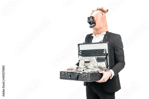 Money is wealth. Businessman in horse head mask hold suitcase with dollars. Investment for money