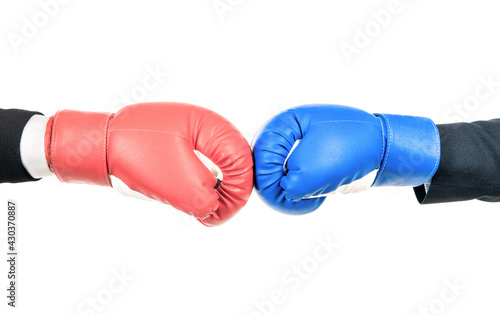 Challenge to fight. Red boxing glove against blue glove. Business competition © Olena